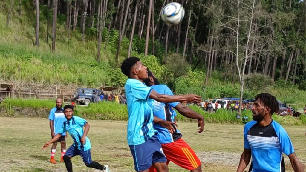 Korons player jumping up to head the ball against his YPS opponent in the Hotspring Alluvial Mining sponsored Xmas Sports Tournament played at Riverside Primary School Sports at field Ward 09 in Wau Rural LLG today.